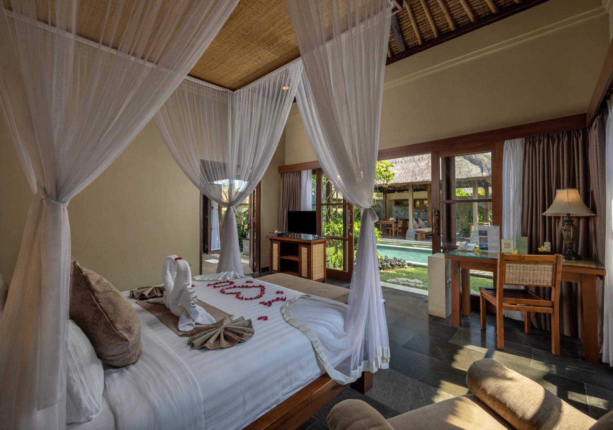 Ubud Nyuh Bali Resort & Spa Oda fotoğraf A bedroom at the resort