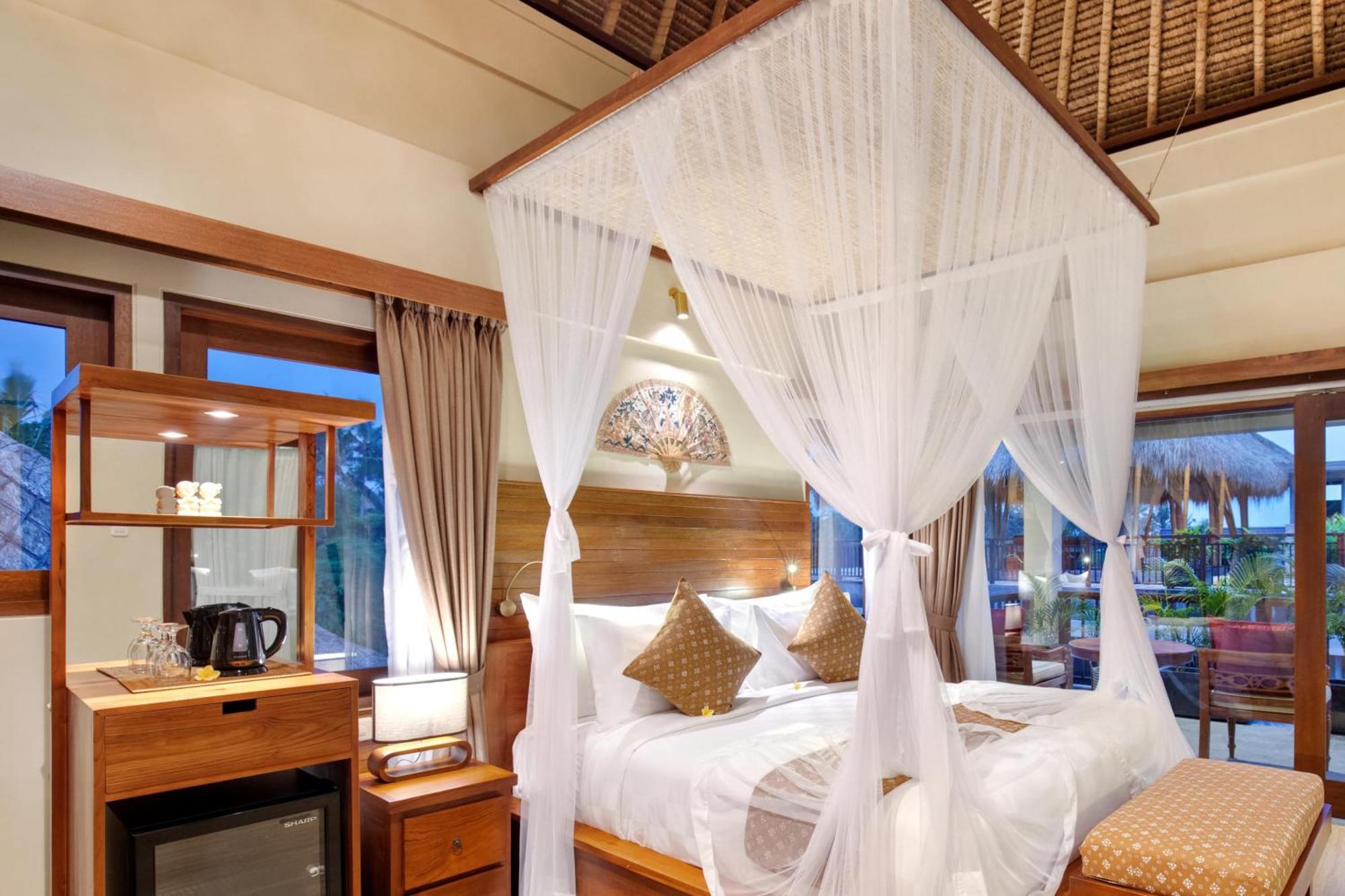 Ubud Nyuh Bali Resort & Spa Oda fotoğraf A mosquito net over a bed